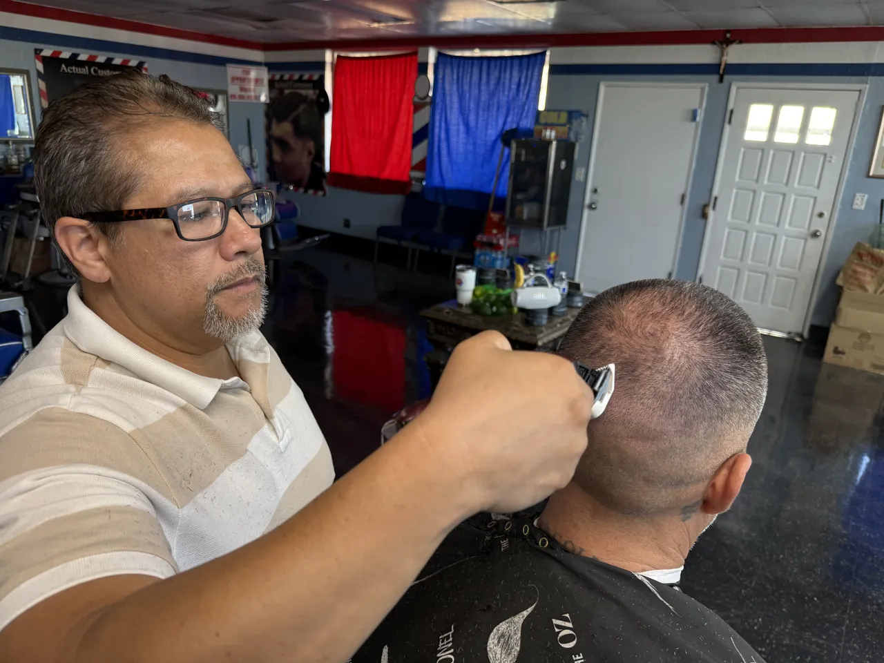 Jesse giving a customer a clipper cut